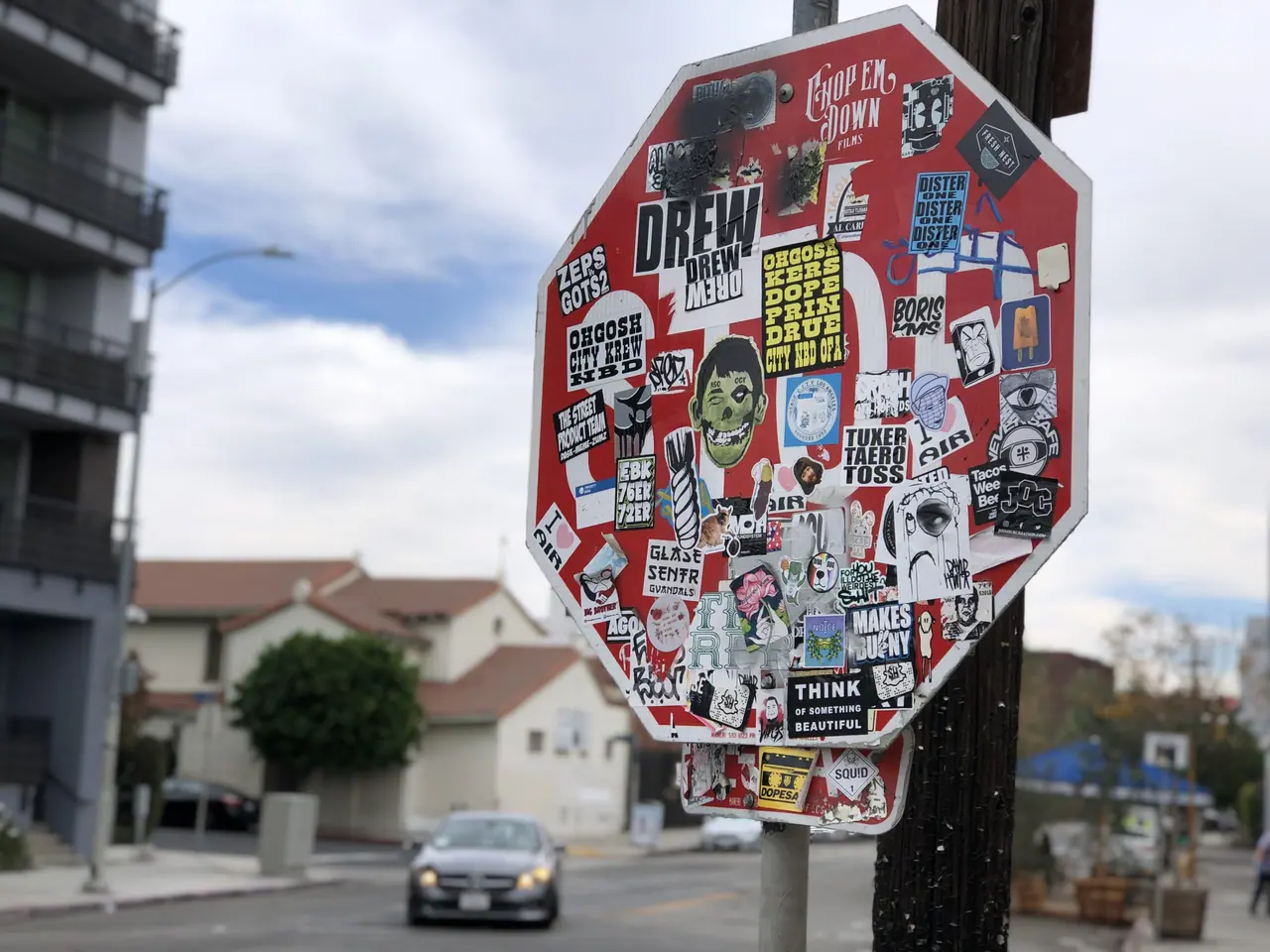 A sticker-covered stop sign on a Los Angeles street.