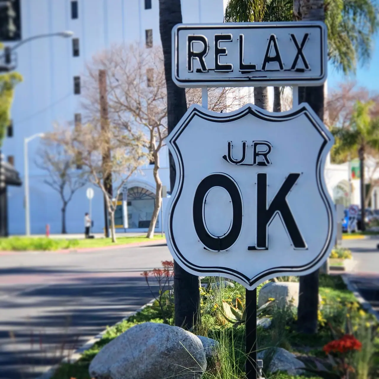 An encouraging roadside sign in West Hollywood.