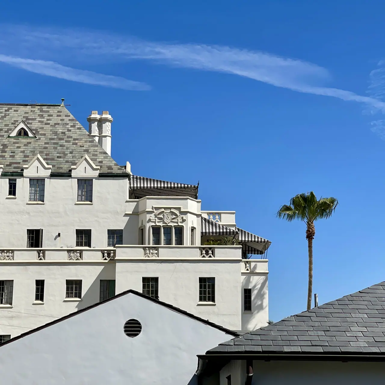 Chateau Marmont beneath a clear blue sky.