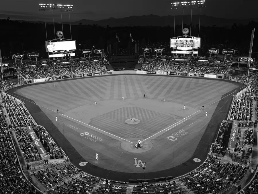 The illuminated baseball diamond at Dodger Stadium after dusk.