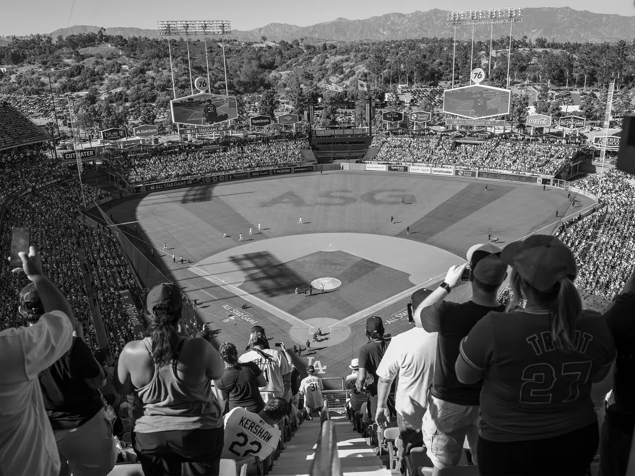 Fans watching the field from the upper seats at Dodger Stadium.