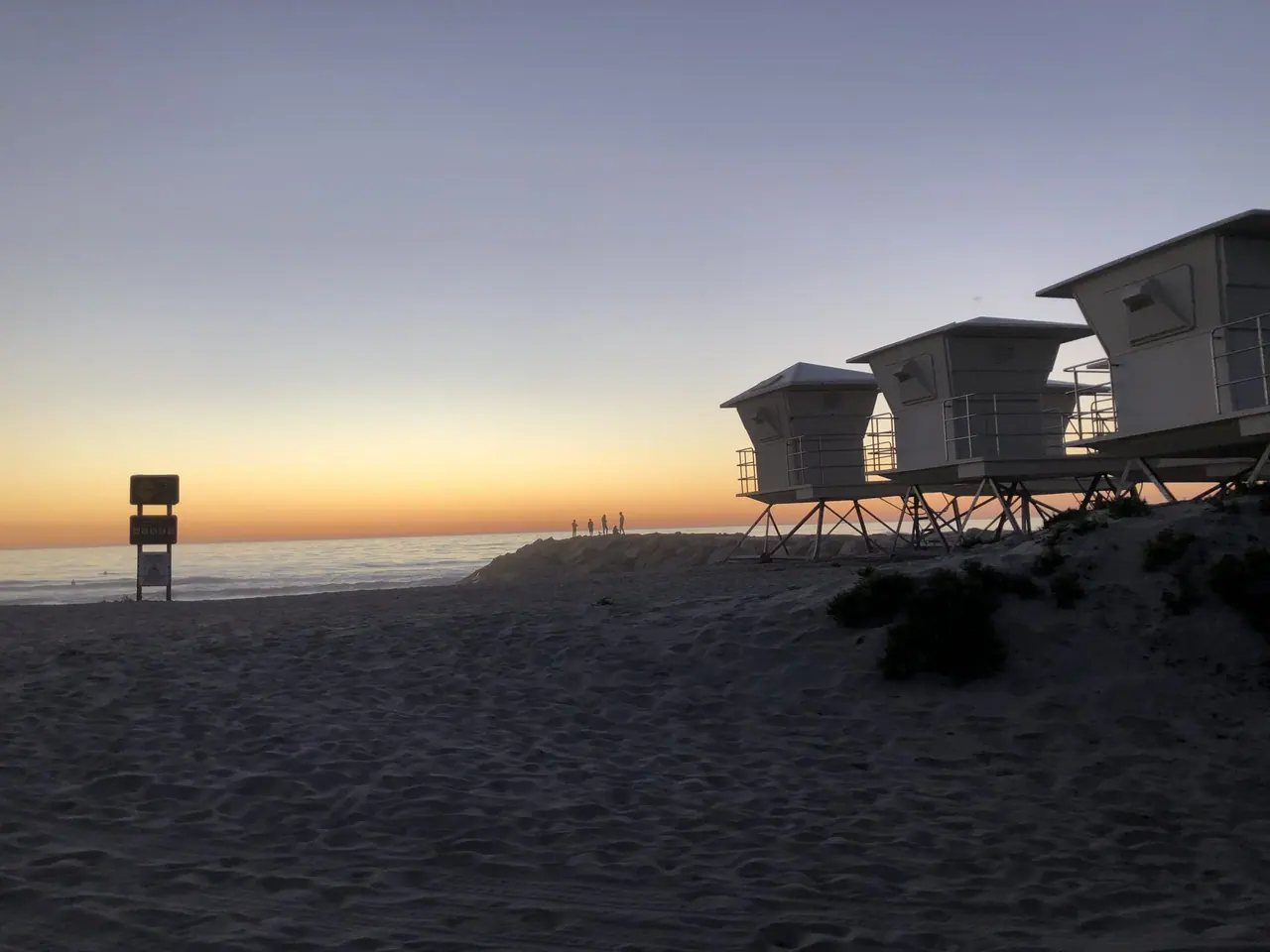 Beach cottages at dusk.