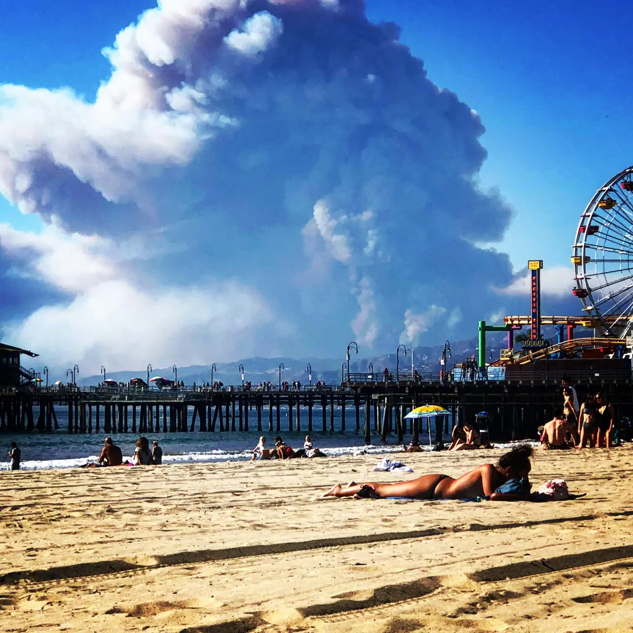 Wildfire smoke rising beyond the Santa Monica pier.