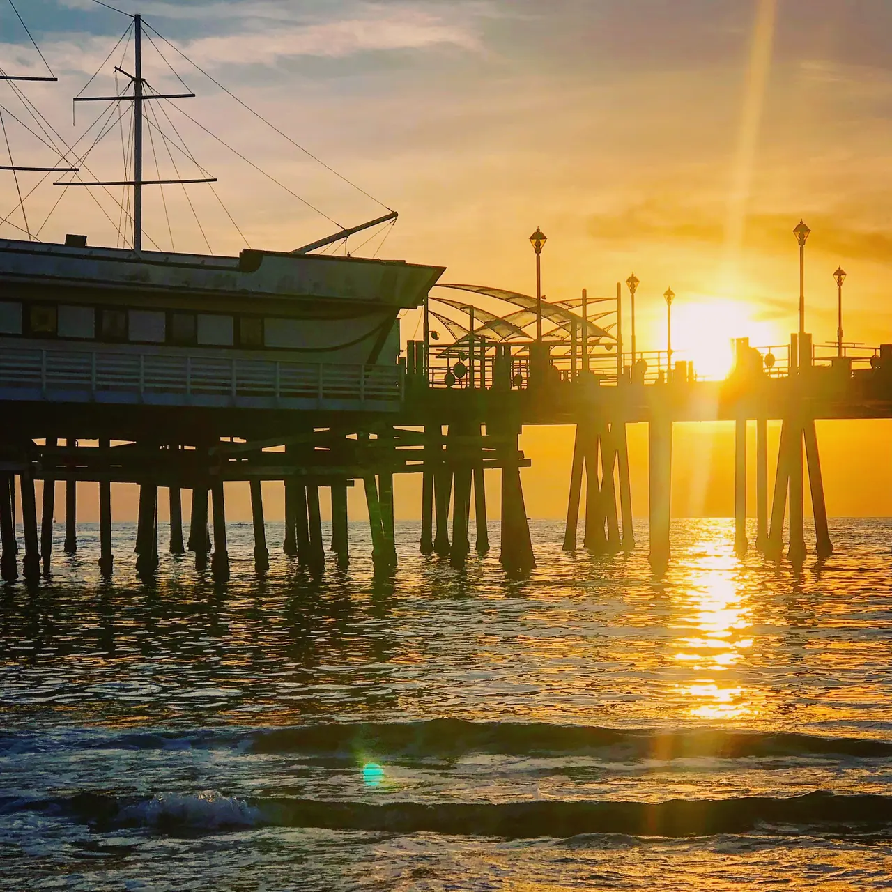Sunset beneath the pier at Redondo Beach.